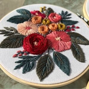 3 handcrafted embroidered flowers in a wooden hoops 10.5" 8" 6"